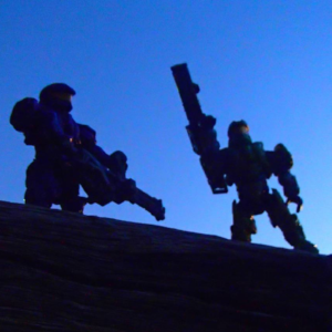 Two space soldier outdoors figures holding large weapons, sky is sunset dark blue